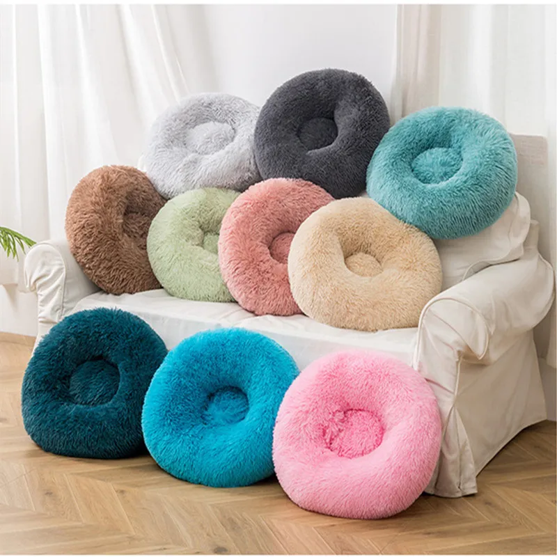 Calming donut dog bed with raised bolstered rim for anxious pets